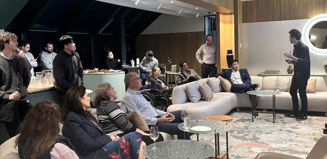 Mark Lazarus presenting to an audience in Sydney